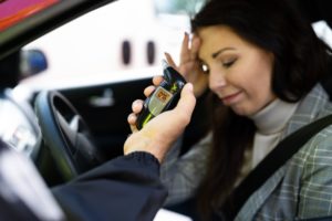 A woman unhappy with her breathalyzer results.