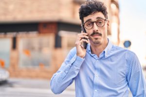 A man on the phone with the DMV regarding his DUI hearing.