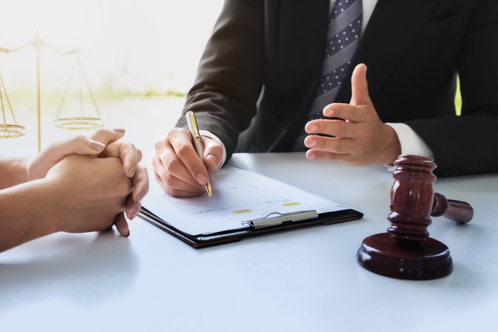 An attorney explaining employee misclassification to his client.