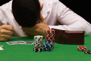 Distraught gambler playing blackjack