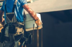 A worker moving heavy objects.