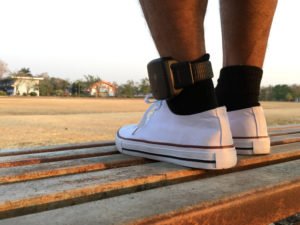 A man wearing a SCRAM bracelet/ankle monitor.