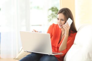 A disgruntled woman on the phone with an insurance company attempting to get a settlement without the help of an attorney.