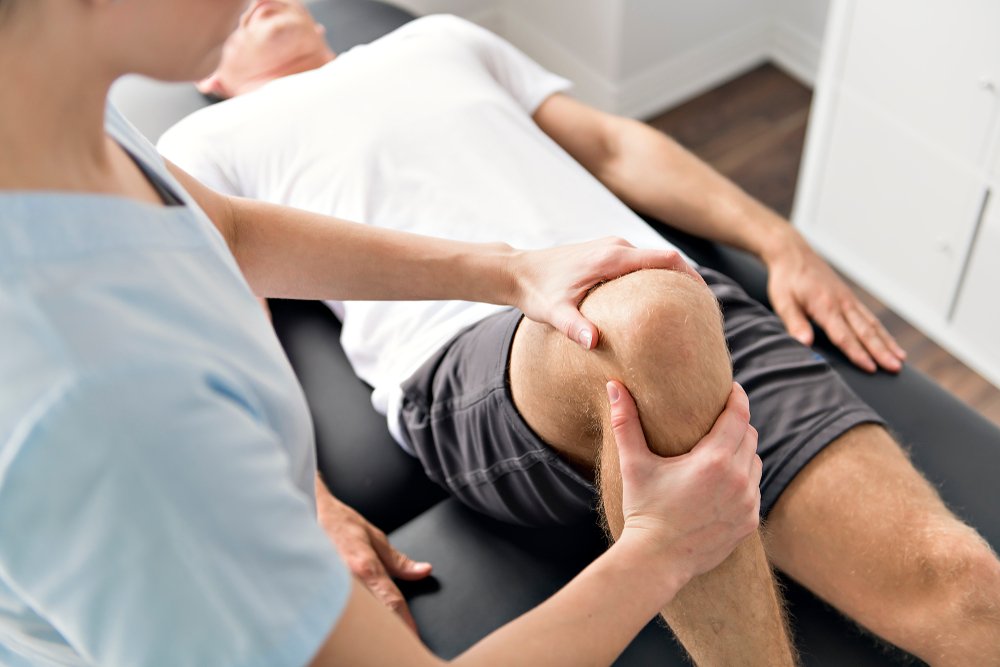 A person undergoing physical therapy due to a knee injury.