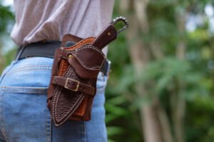 Knife in the case attached and hang on the belt of the woman