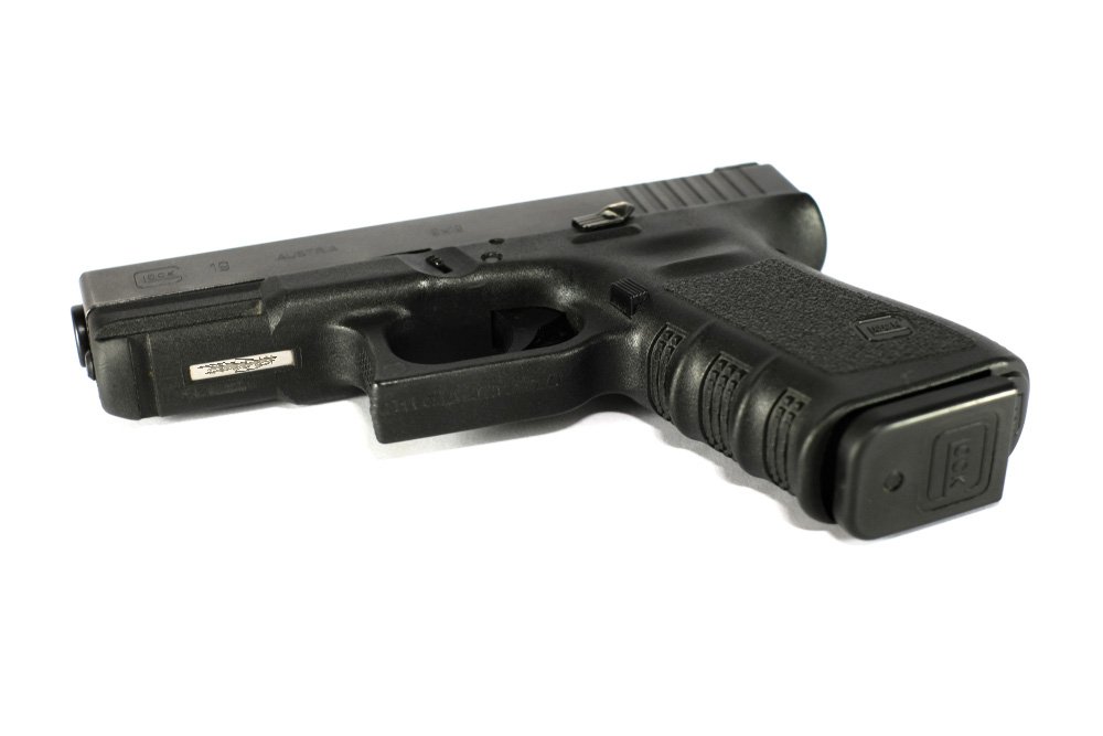 A Glock pistol with its serial number scratched.