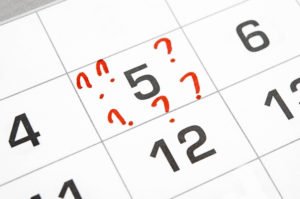 A calendar date with a question mark on a day, indicating a missed court date.