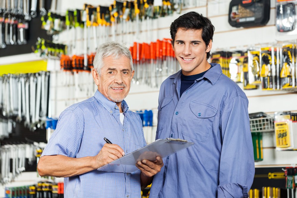 A father and son going through their daily check list at their family business. Nepotism in the private sector is not illegal in California.