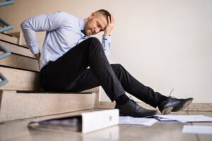 Man after falling down stairs at work