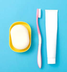Top view of soap, toothbrush and toothpaste. 