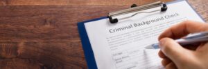 Clipboard that says Criminal Background check