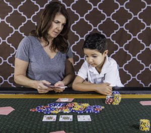Adult and child at a gaming table 