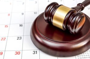 Judge's gavel on a calendar, signifying a speedy trial