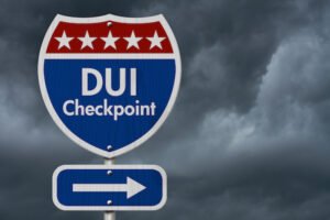 Sign that says "DUI checkpoint" with an arrow