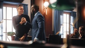 Attorney in courtroom congratulating defendant