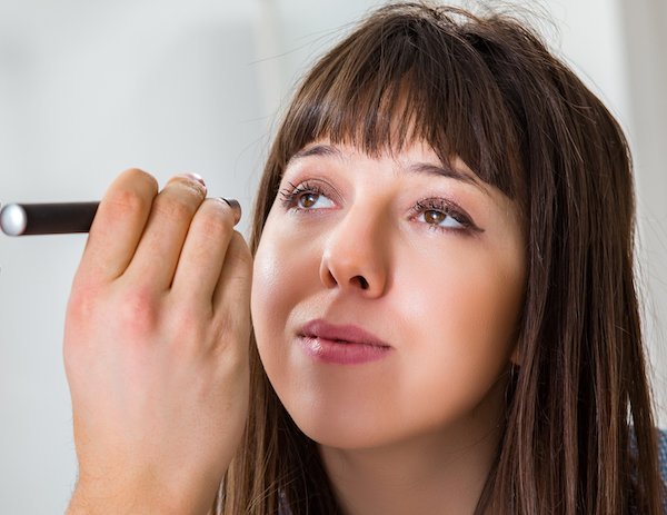 Doctor examining patients eye in hospital