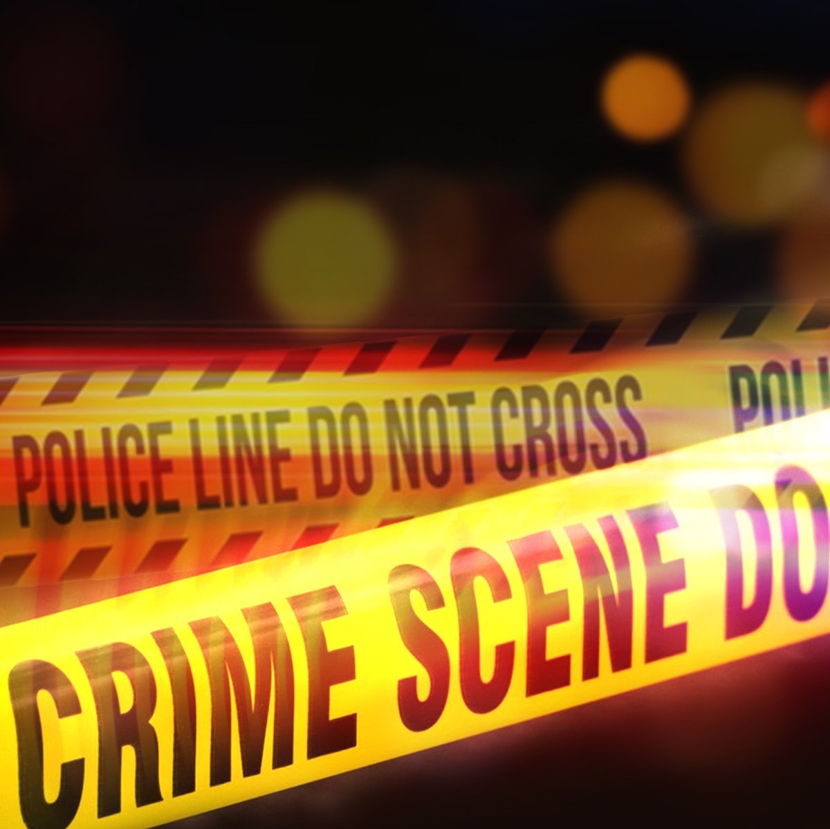 Cinta amarilla de 'Escena del crimen' acordonando una escena de homicidio
