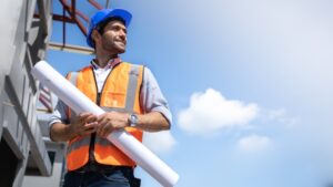 Contractor on worksite against a blue sky