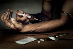 Man shooting up with heroin