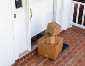 Packages on front porch of home during holiday season