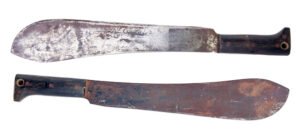 Two machetes against white background