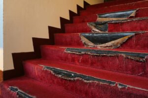 Torn carpeting on a staircase 