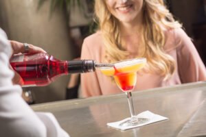 Bartender serving underage girl drink
