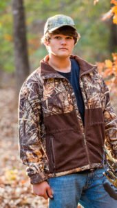 Young teen hunting in the woods