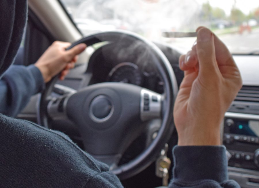 Driver holding joint while driving