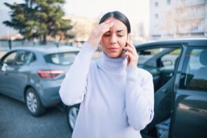 Woman calling her insurance after an accident