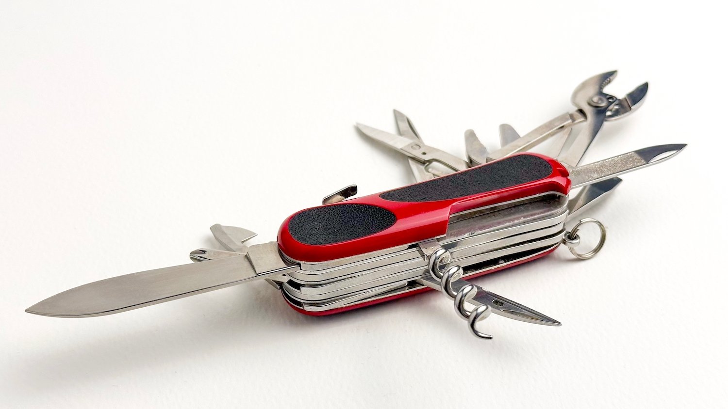 Swiss army knife against a white background