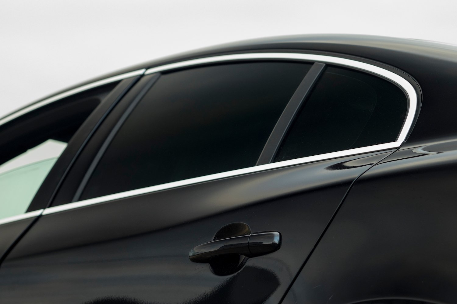 Sedan with light front window but darkly tinted rear window