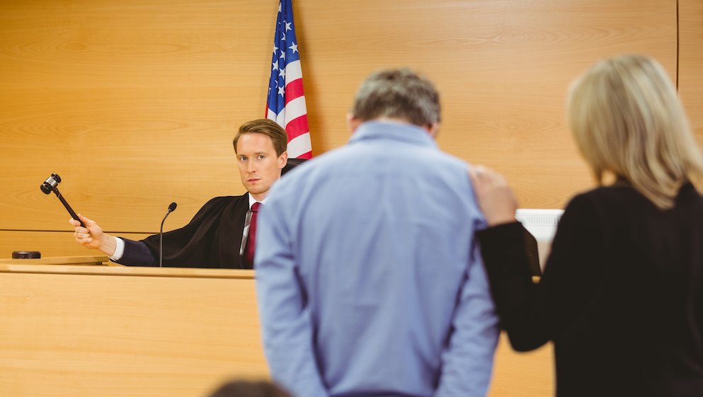 Courtroom where the judge denied the defendant's motion for a new trial, and his attorney is comforting him