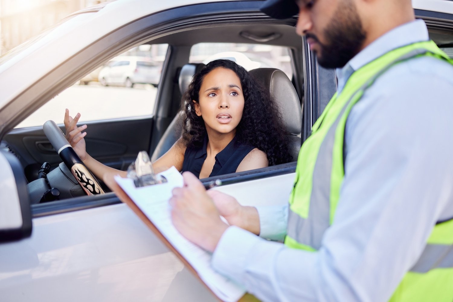 Woman driver during a traffic stop trying to argue her way out of a traffic ticket (which carries DMV points)