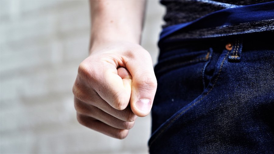 Man making a first in preparation for a punch