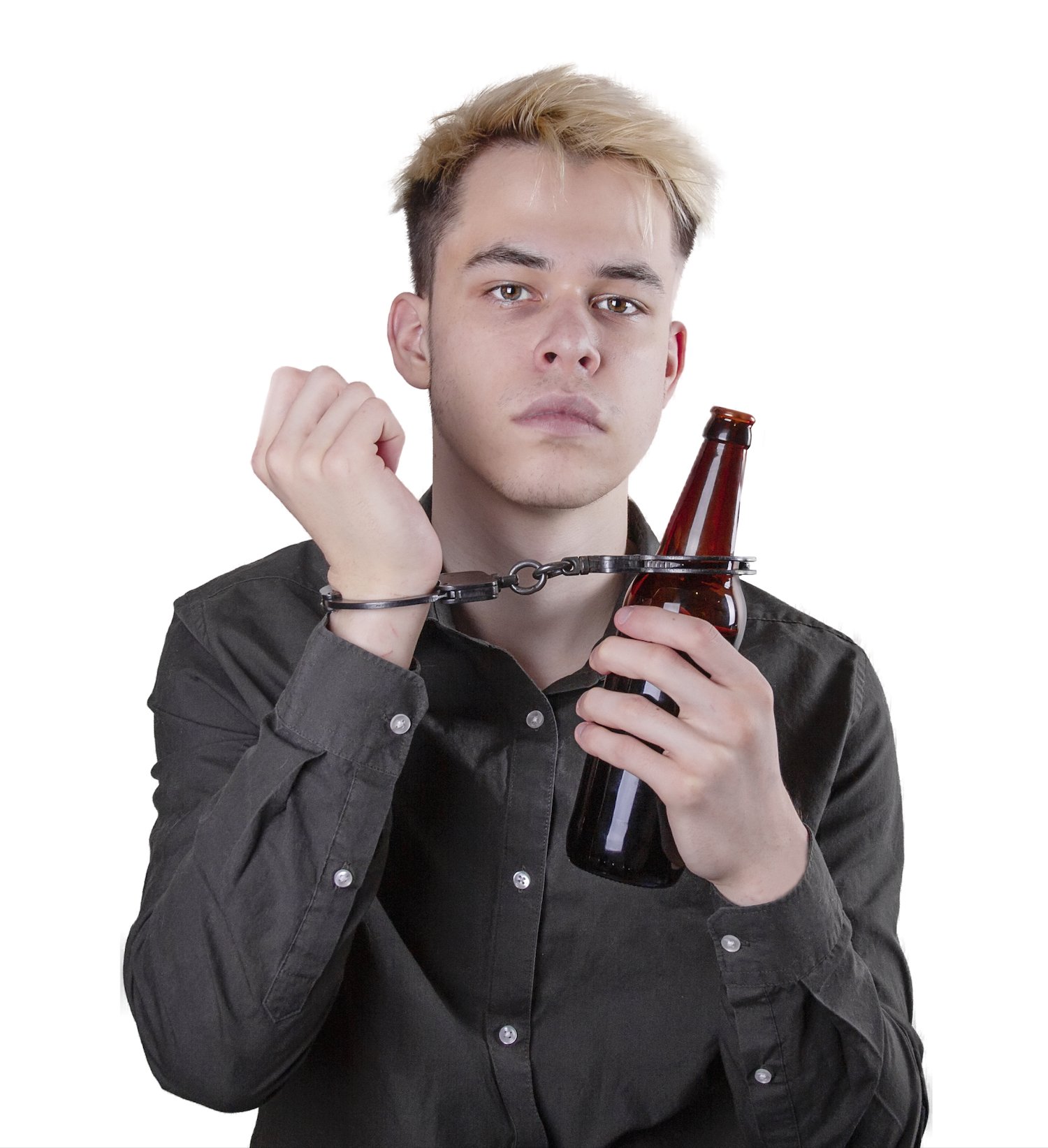 Young teen handcuffed to a beer bottle against a white background